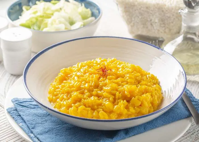 sagre lombardia marzo 2026 - Un piatto di risotto alla milanese